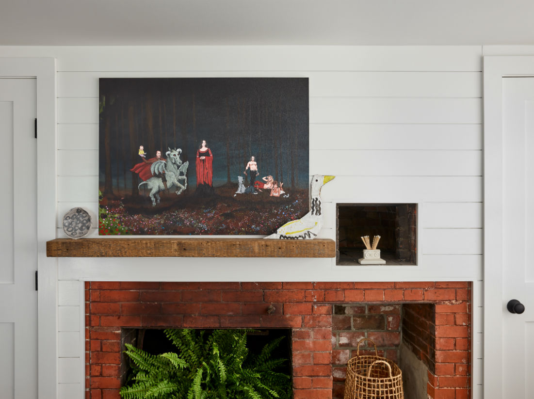 living-room-brick-fireplace-wooden-mantle-hanging-painting